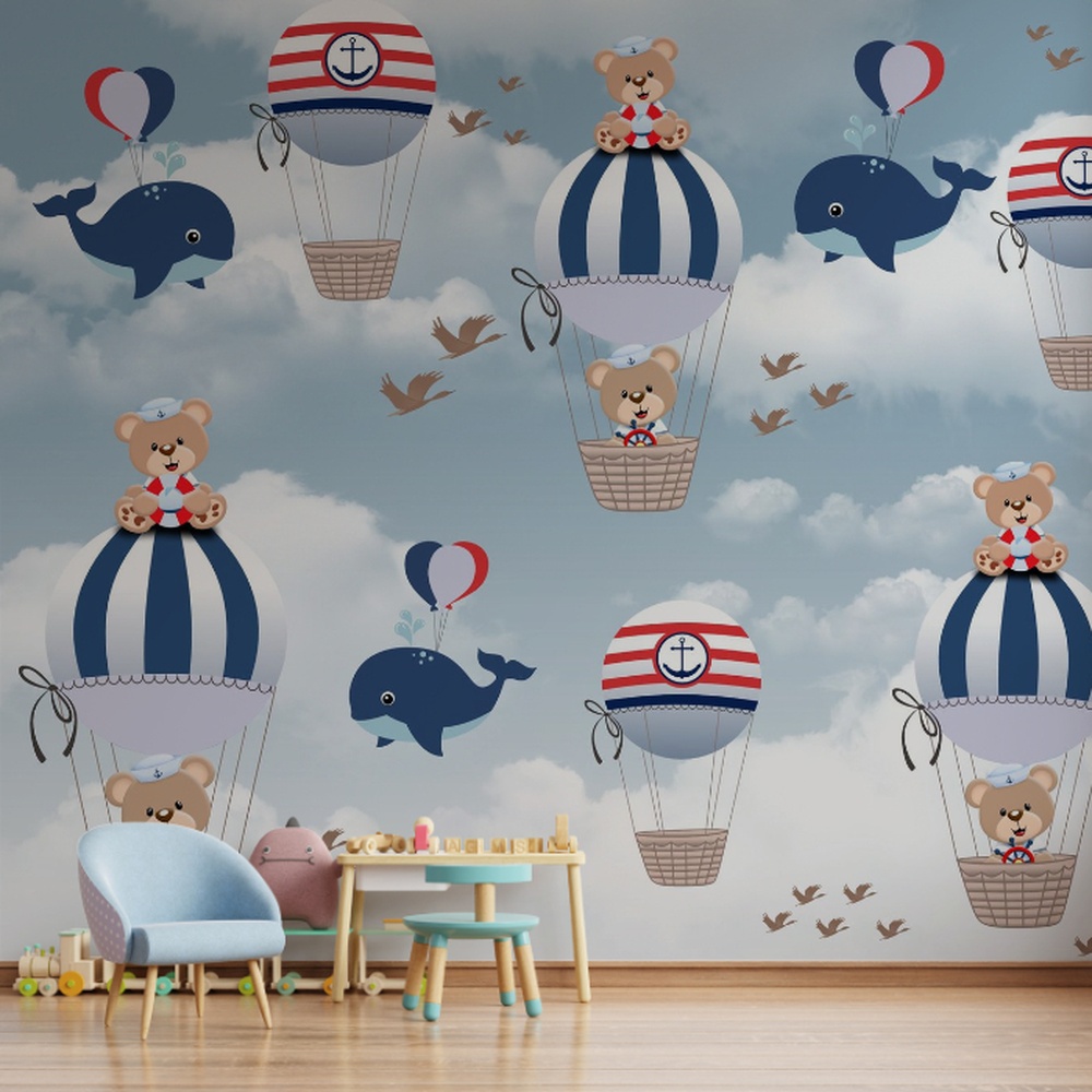 Decoração de quarto infantil com tema ursinhos marinheiros em tons de azul e branco.